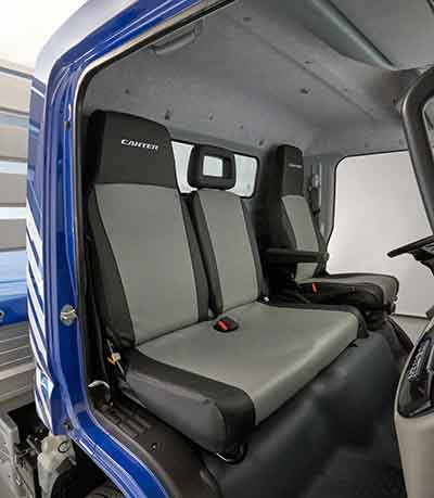 The FUSO Seat Cover is the best way to protect the interior against wear and grime. It extends the lifetime of the seats and helps to retain the value of the Canter by giving the truck a high-quality appearance.  The FUSO Seat Cover “VINYL” provides a perfect protection against dirt as well as being oil- and stain resistant. This variant is perfect for drivers working at construction sides or as gardeners.